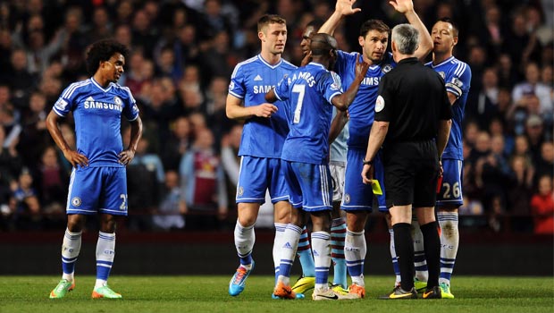 Chelsea team with referee Chris Foy