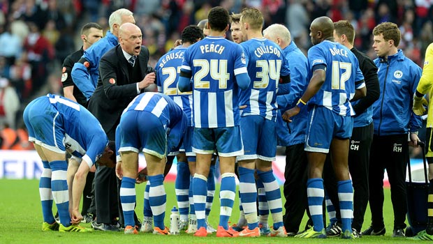 Uwe Rosler Wigan Athletic manager with latics players