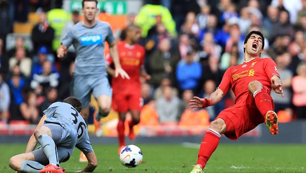  Luis Suarez Liverpool and Paul Dummett Newcastle United