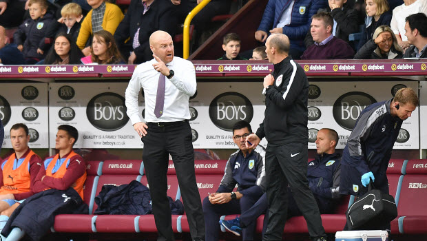 Burnley manager Sean Dyche speaks with the fourth official during the Premier League match