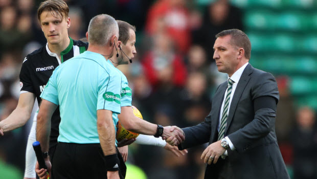 Celtic manager Brendan Rodgers shakes hands with referee William Collum