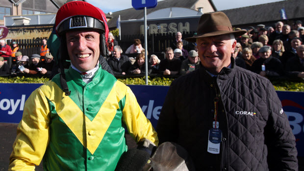 Trainer Colin Tizzard speaks to jockey Robbie Power after riding Fox Norton